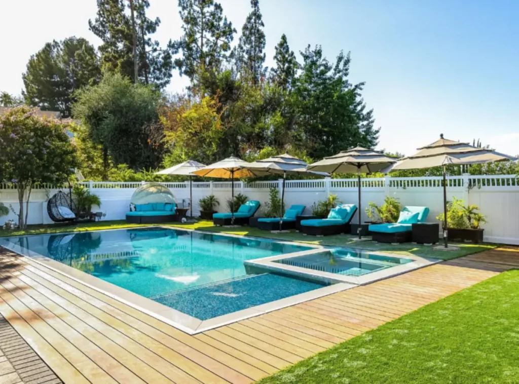 Outdoor therapeutic pool and lounge area at a luxury rehab center designed to promote healing, relaxation, and recovery in a restorative environment.